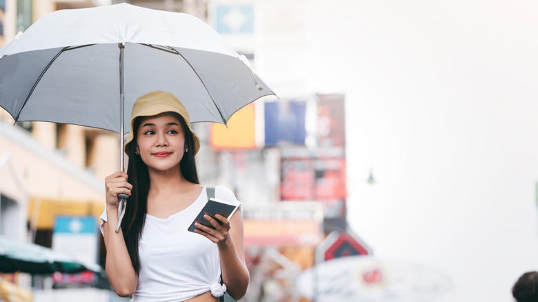 Woman with umbrella in Bangkok