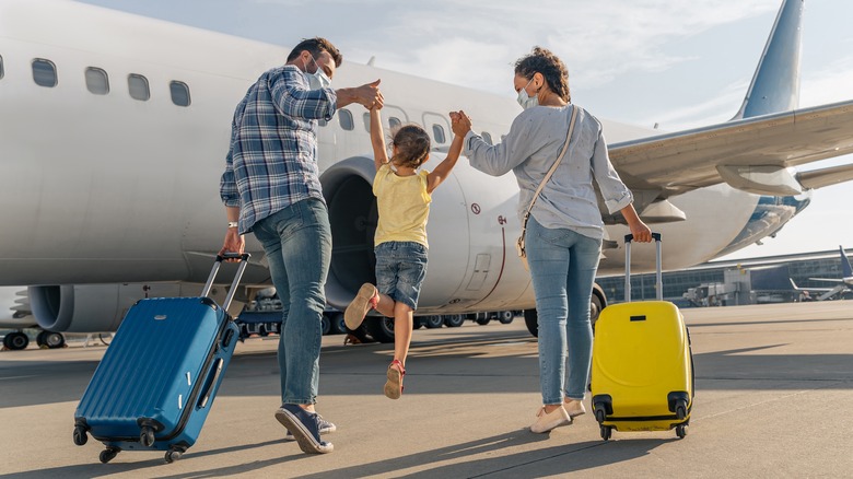 child boarding plane