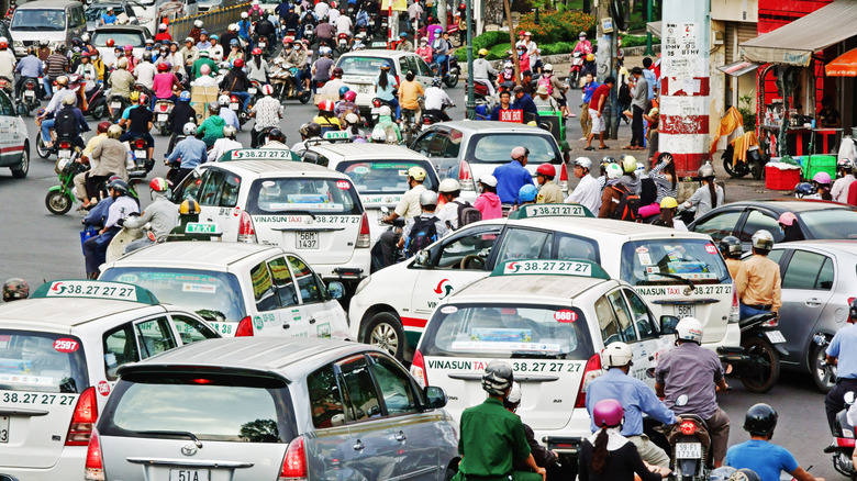 Cars and motorbikes clog a street in Saigon, Vietnam