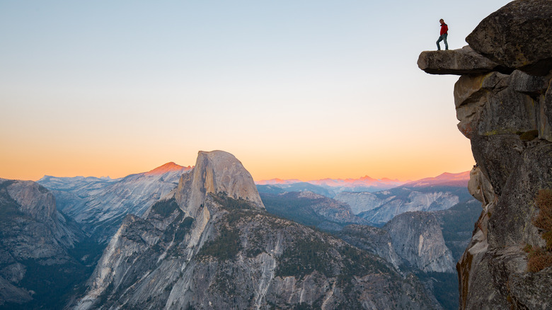 Hiker overlooking Yosemite Half Dome