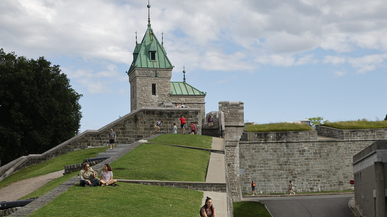 People sitting on Quebec walls