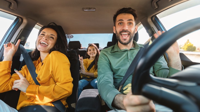 family singing in car