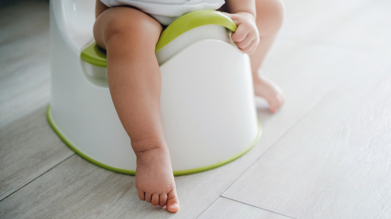 a child sitting on potty