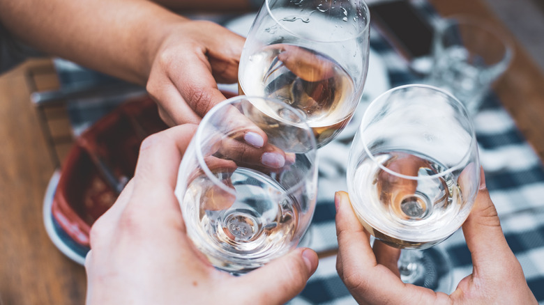 Group toasting with wine glasses