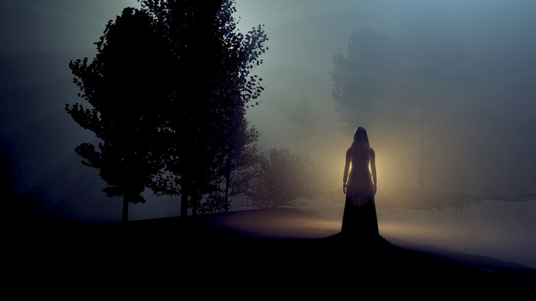 dark woman standing in forest