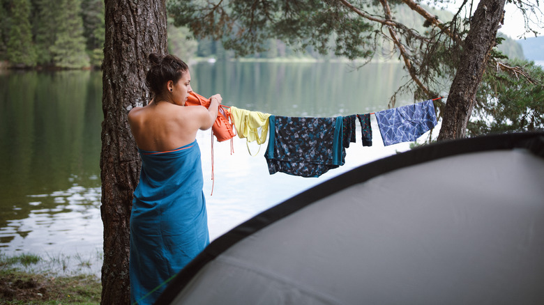 Woman hang drying clothing 