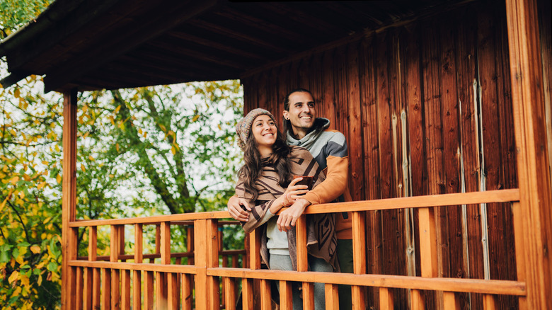 couple on cabin porch