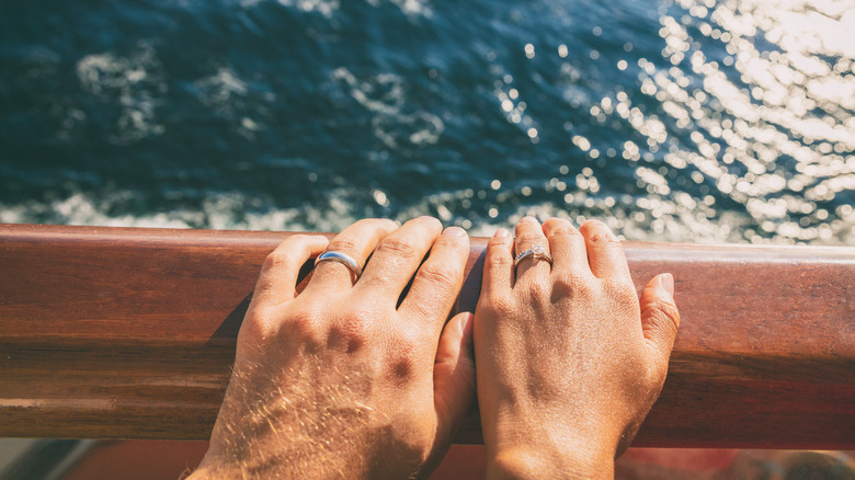 newlyweds' wedding rings on cruise