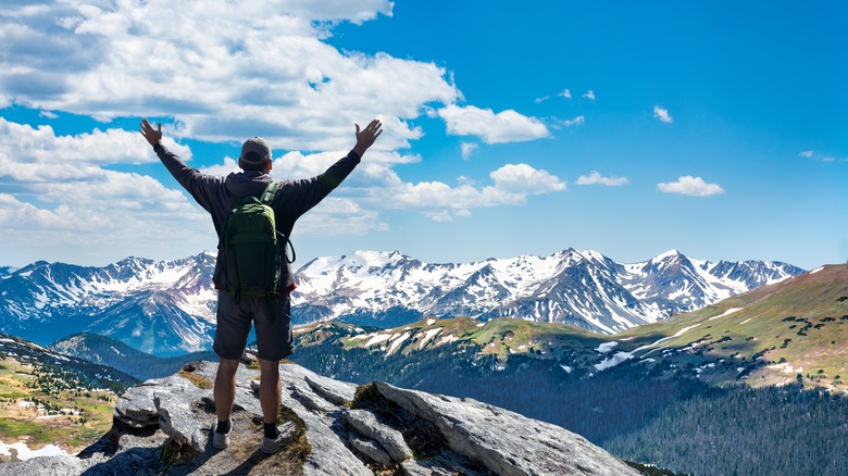 triumphant hiker Rocky Mountains