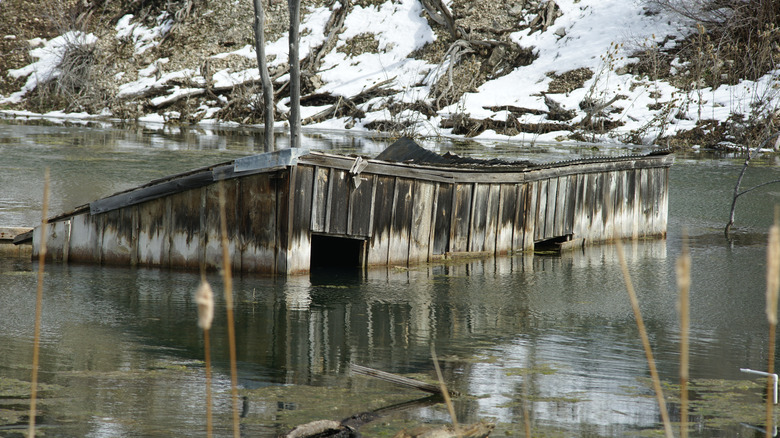 A shed submerged under flood water