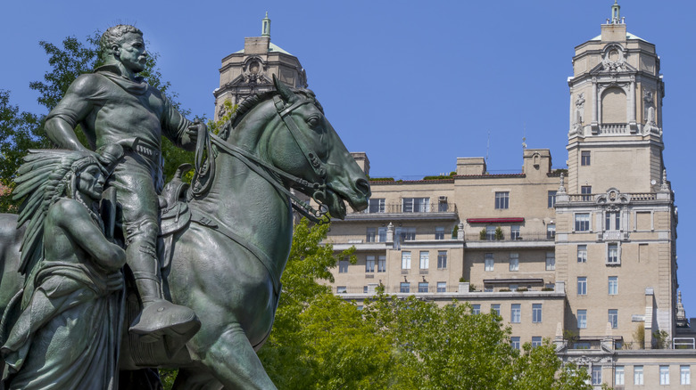 statue with museum in background