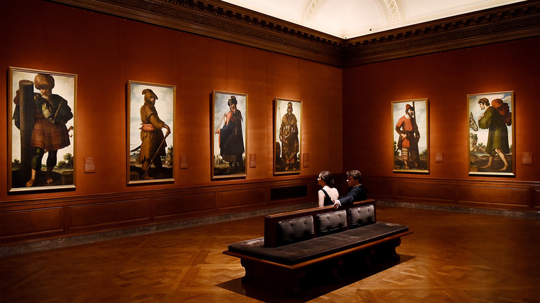 couple enjoying view of paintings