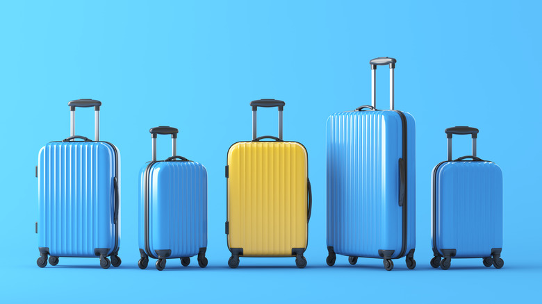 suitcases against blue background
