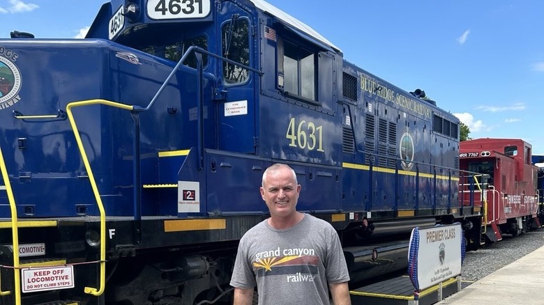 Man in front of train