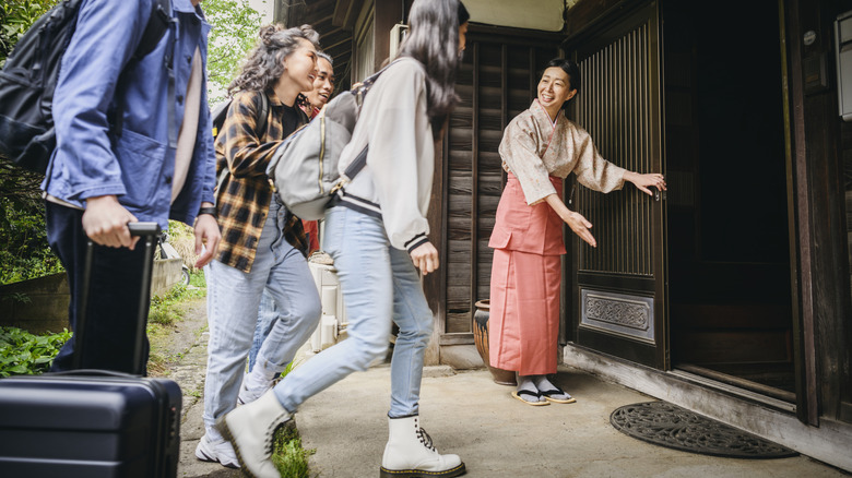 Travelers arriving at a Japanese hotel