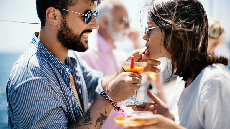 Cruise passengers sipping on cocktails