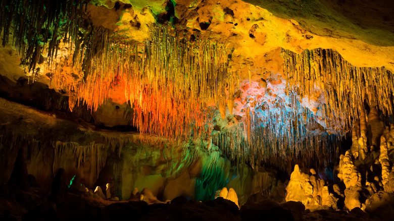 Colorful lights on the stalagmites and stalactites in Florida Caverns.