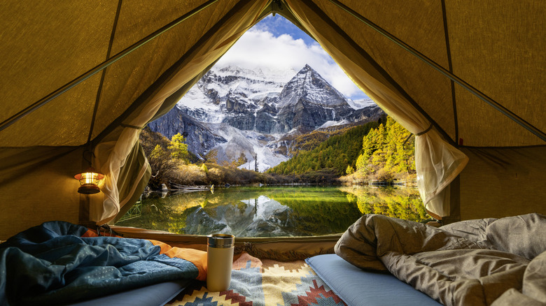 view of mountain and lake vista from inside of tent