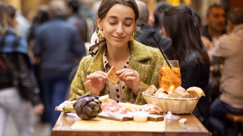 Woman eating at restaurant