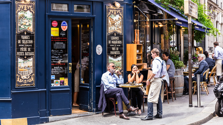 people eating outside French bistro