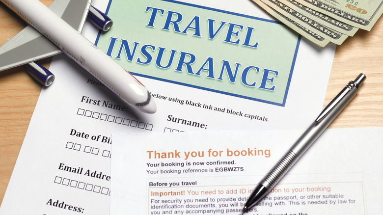 A travel insurance form with pen