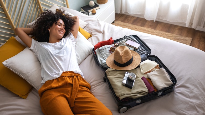 woman happy with luggage