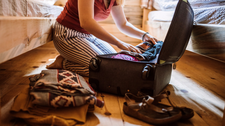 woman packing luggage