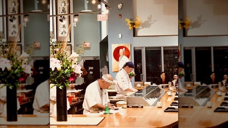 Hidekazu Tojo working in his restaurant