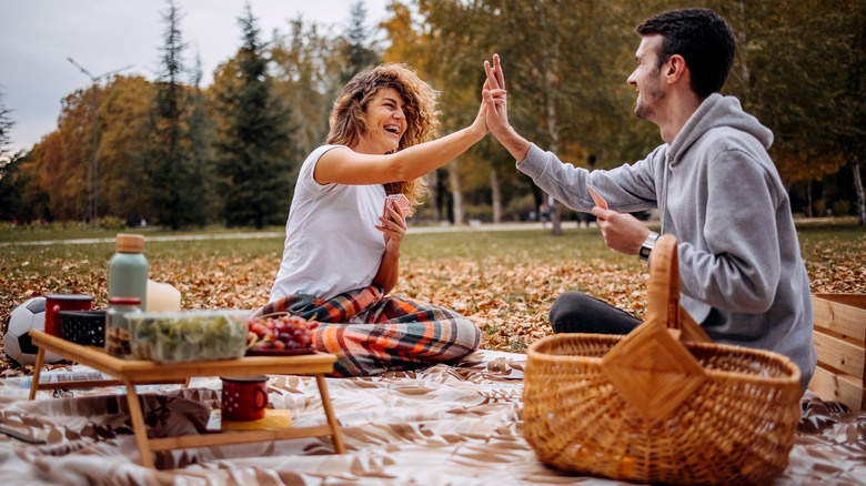 smiling couple having picnic