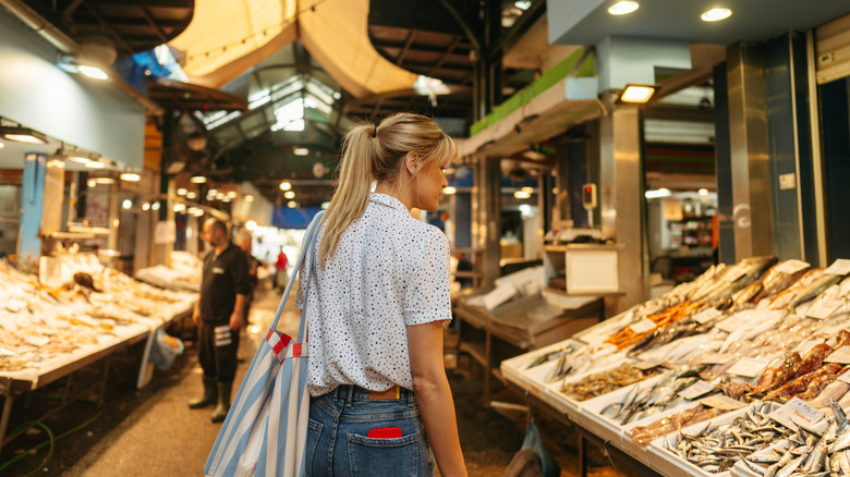 Traveler walking through market