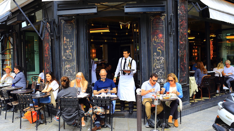 People outside café in France