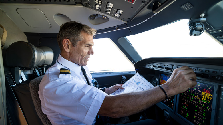 Pilot at work in flight deck