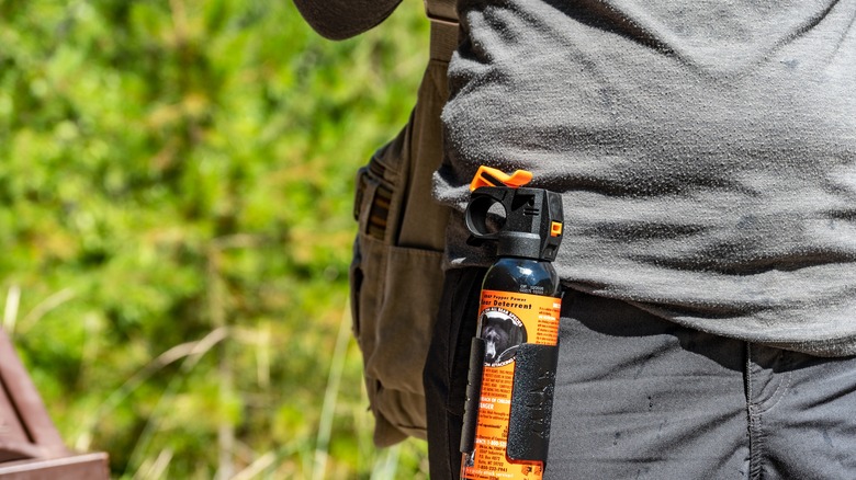 hiker with bear spray on belt