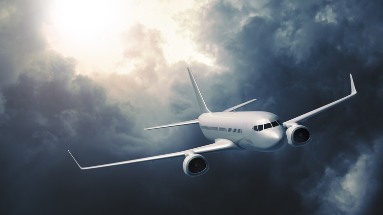 Plane flying in storm clouds