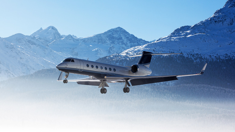 Plane flying in mountain range