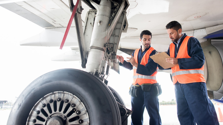 Airplane ground crew members working