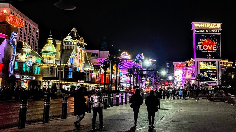 street with bright signs, night