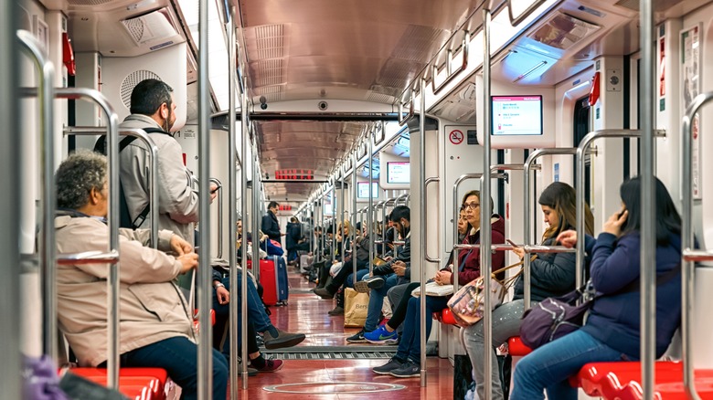 People inside Milan metro train