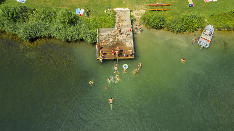 People swimming in a lake