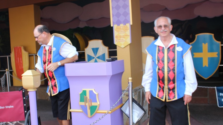 Cast members at Small World ride