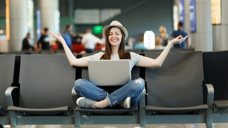 woman relaxing at airport