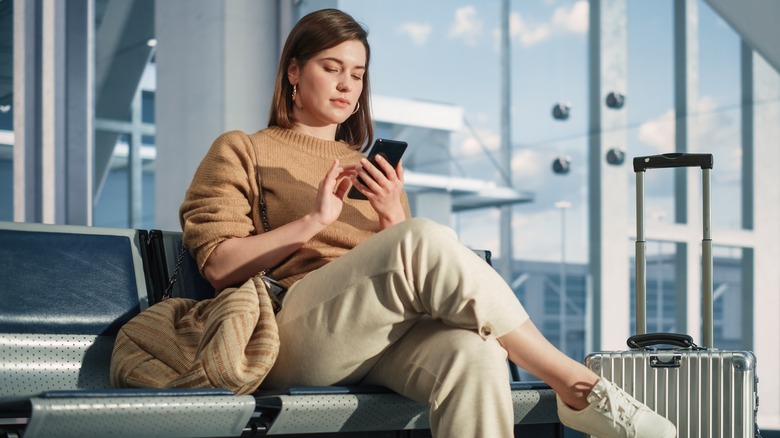 woman waiting at airport gate