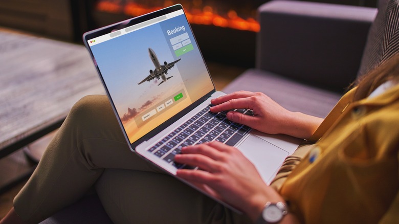 Woman viewing flight booking online