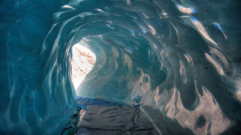 A blue ice cave in the Mer de Glace glacier in the French Alps