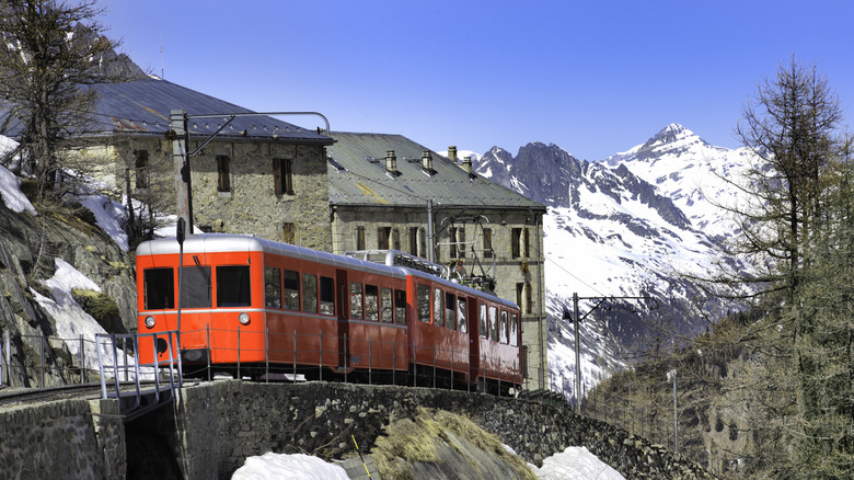 A train traveling through the Chamonix Valley near Mer de Glace in the French Alps