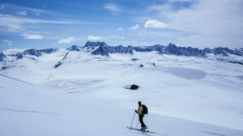 person skiing in snowy mountains