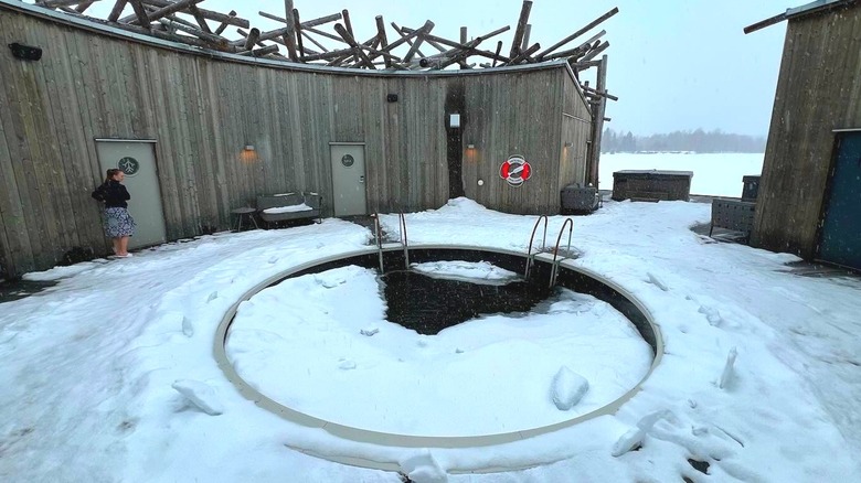 an outdoor cold plunge pool covered in snow