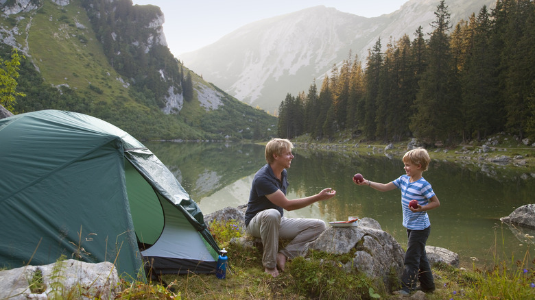 Family camping near lake
