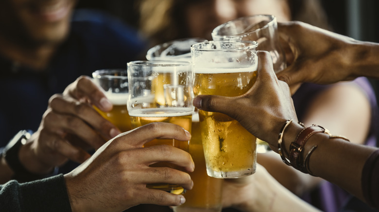 Friends toasting with beer