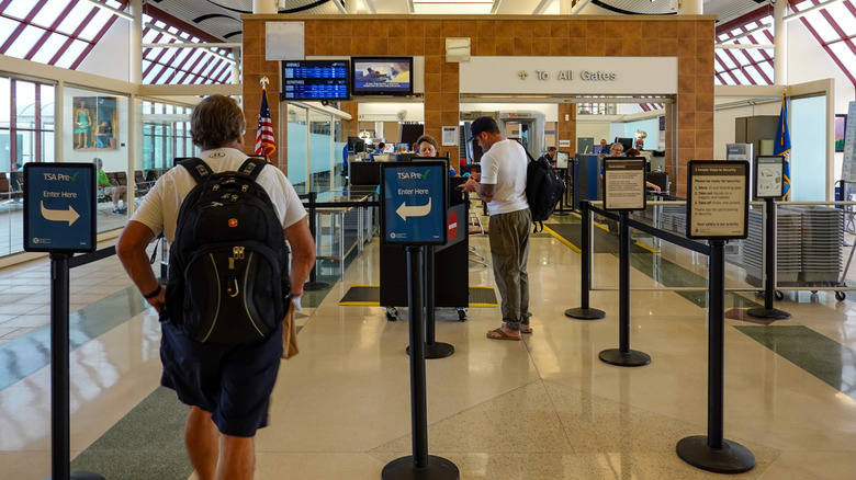 A traveler approaching the TSA PreCheck line